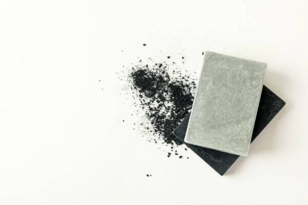 Pieces of natural handmade soap on white background