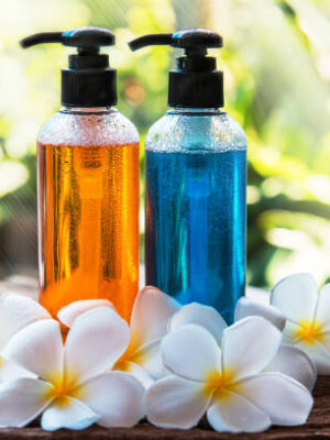 Body care product,shower and shampoo with plumeria flower on nature background