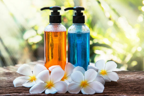 Body care product,shower and shampoo with plumeria flower on nature background